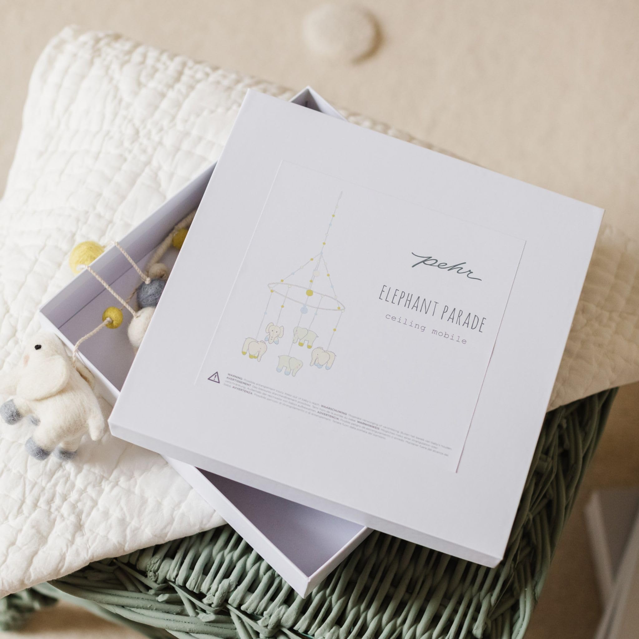 PEHR mobile measures 28h x 9w, creating a bold nursery visual above crib.