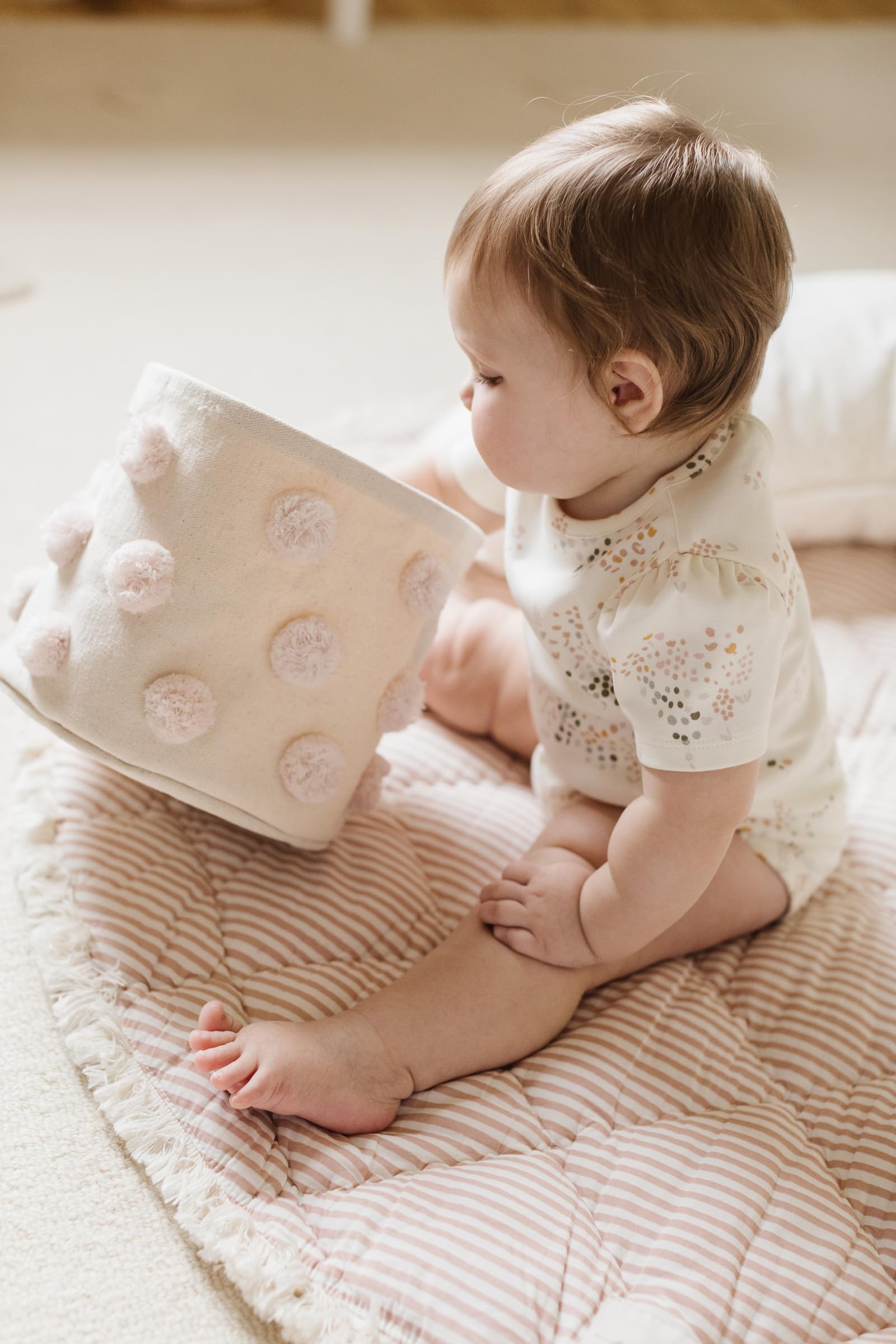 Pehr Pom Pom Basket Mini Blush stackable storage for toys.