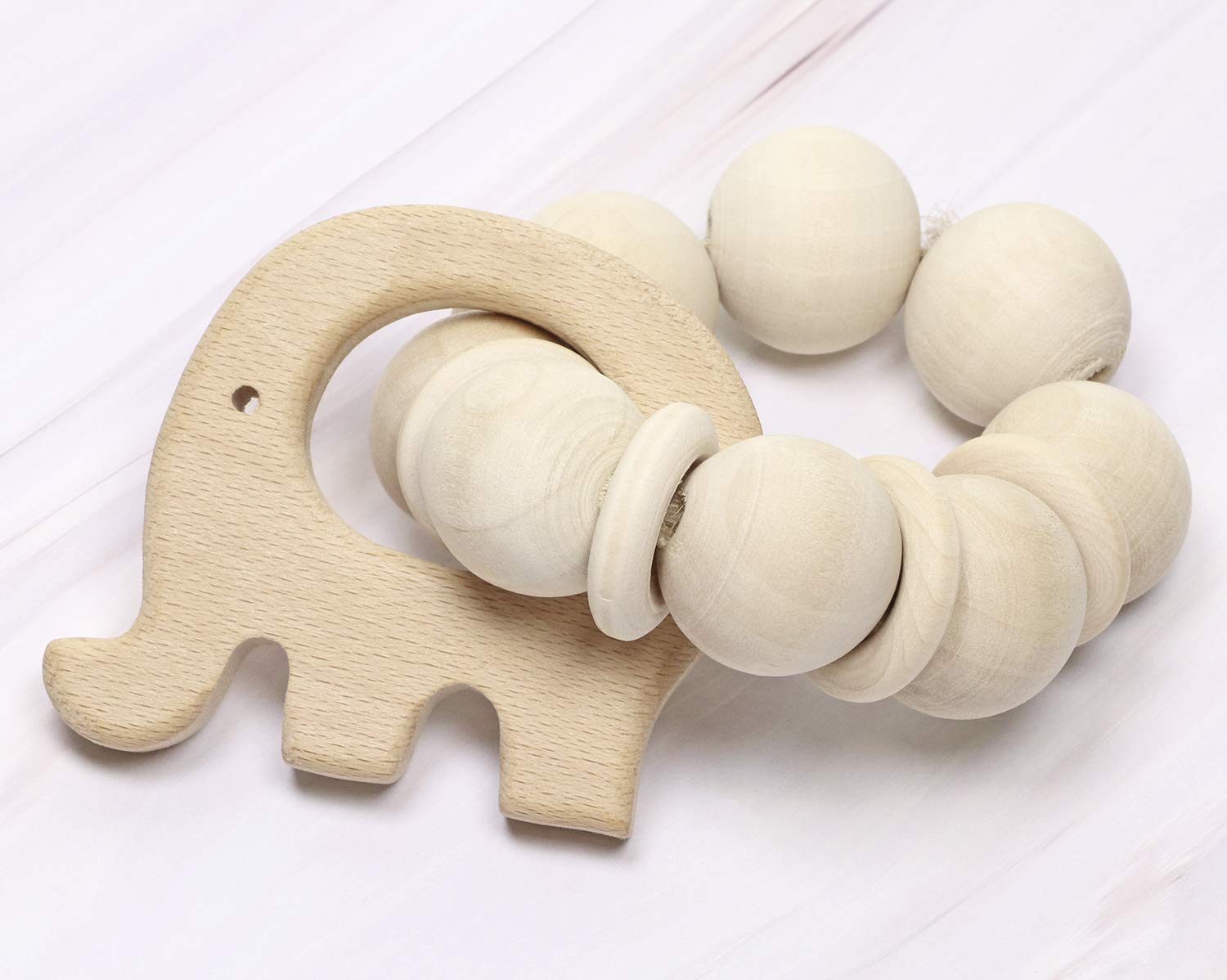 Penta Angel standing duck teething ring, lightweight wood supports fine motor exploration