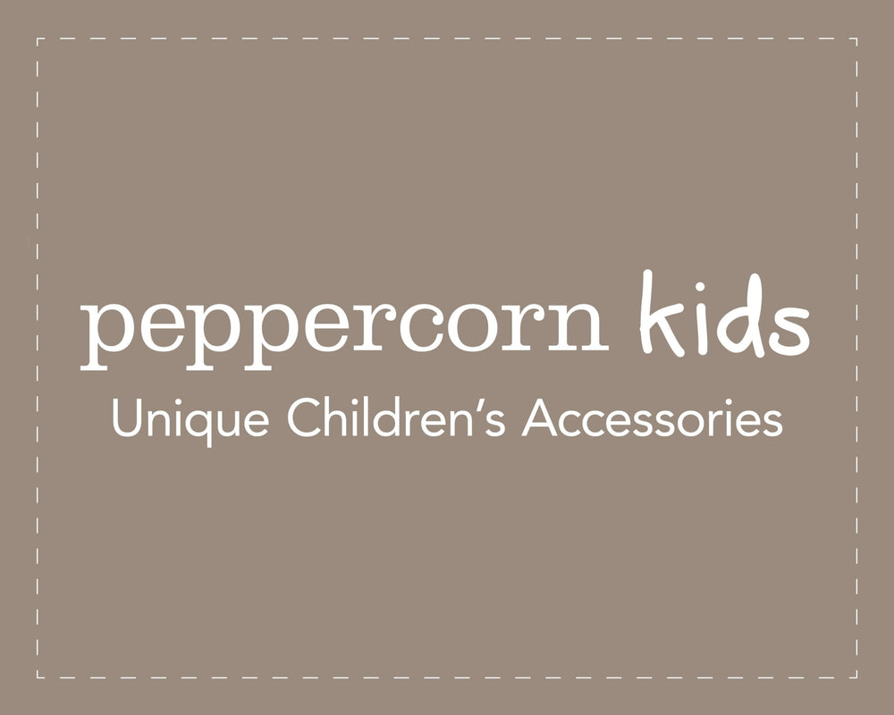 Peppercorn Kids outdoor-ready pink headband great for beach trips.