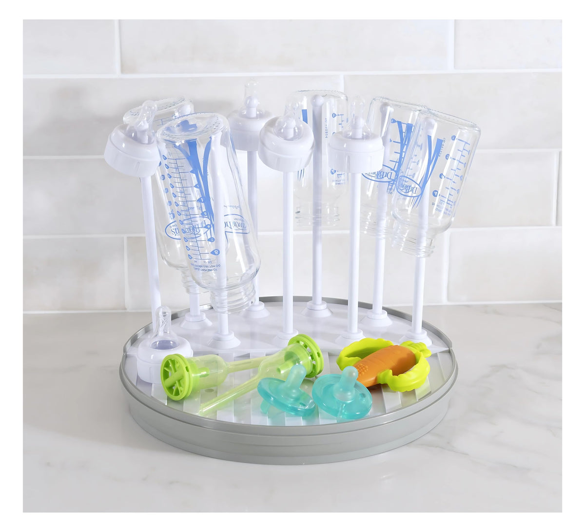 Pequeño bottle drying rack neatly holds bottles for quick air-drying and organized counter space.