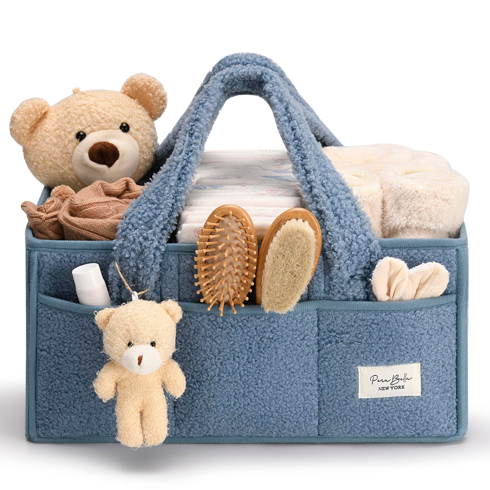 PeraBella baby diaper caddy with handle for easy grabbing during changes.