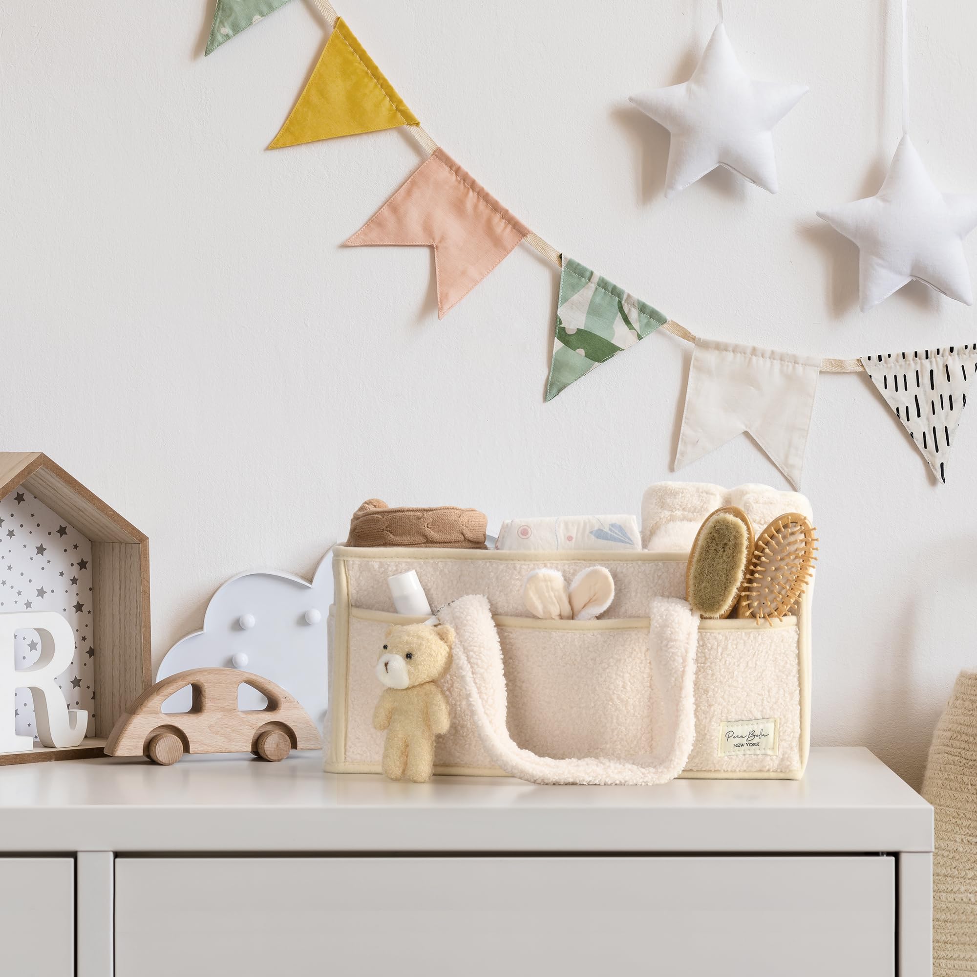 Perabella changing basket for nursery organization and quick diaper access.