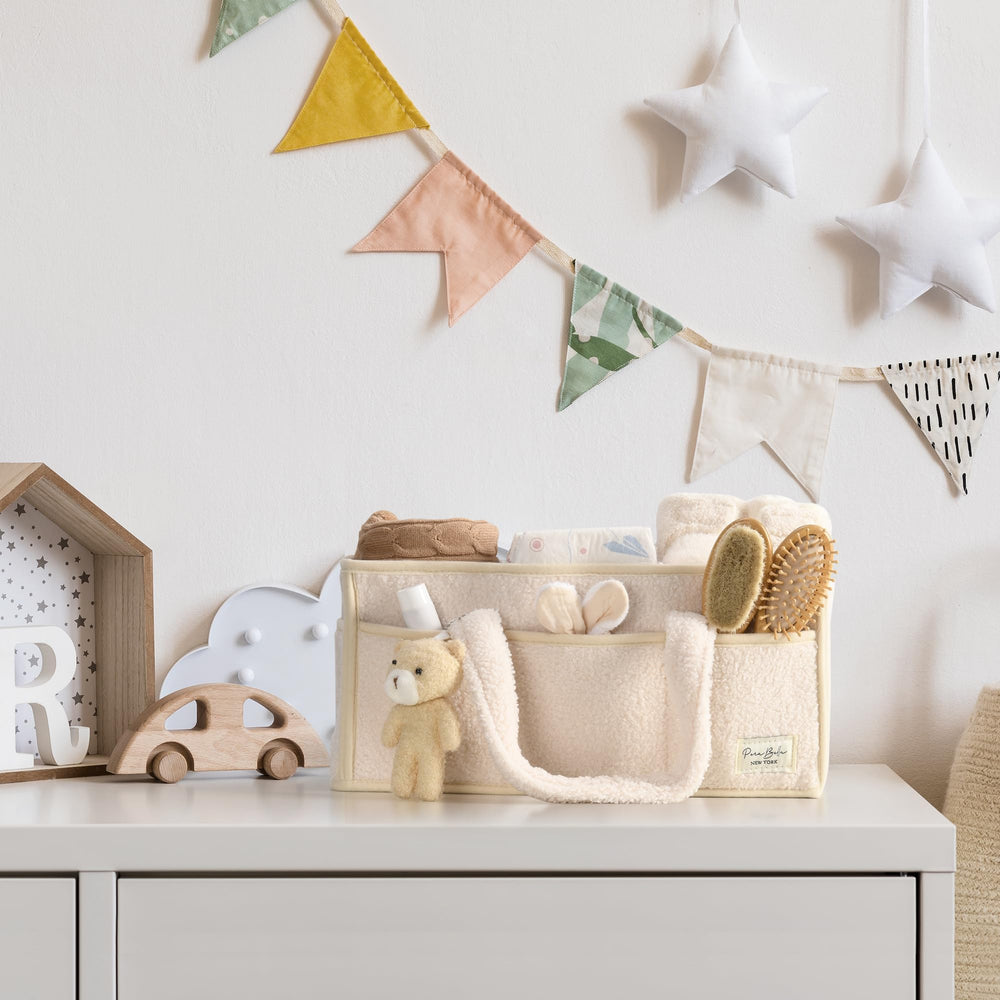 Perabella changing basket for nursery organization and quick diaper access.