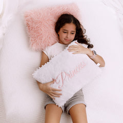 Perfectto Design plush white pillow close-up emphasizes durable, easy-care fabric.