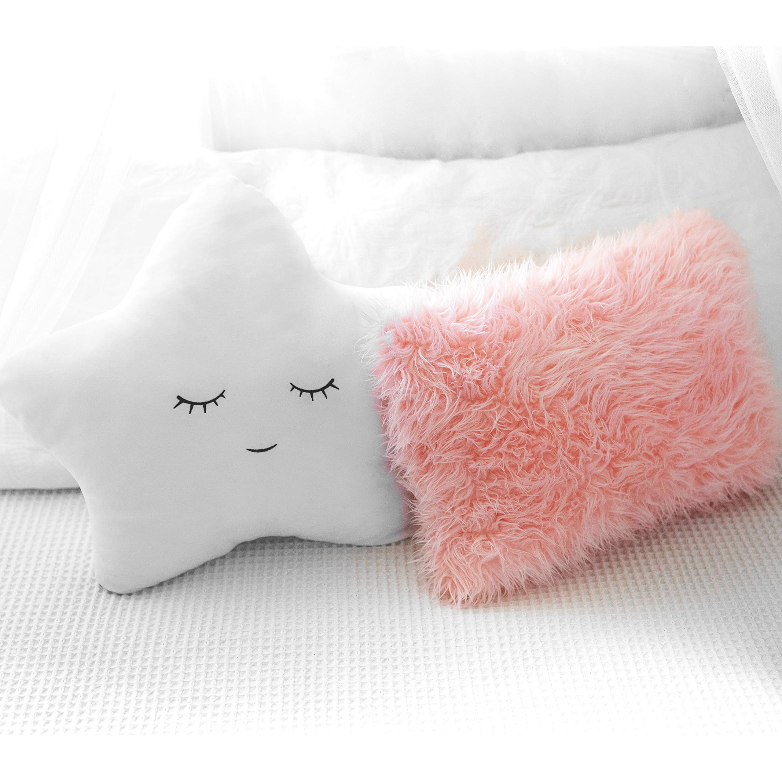 Perfectto Design pink furry pillow close-up emphasizes plush softness for cozy reading corners.