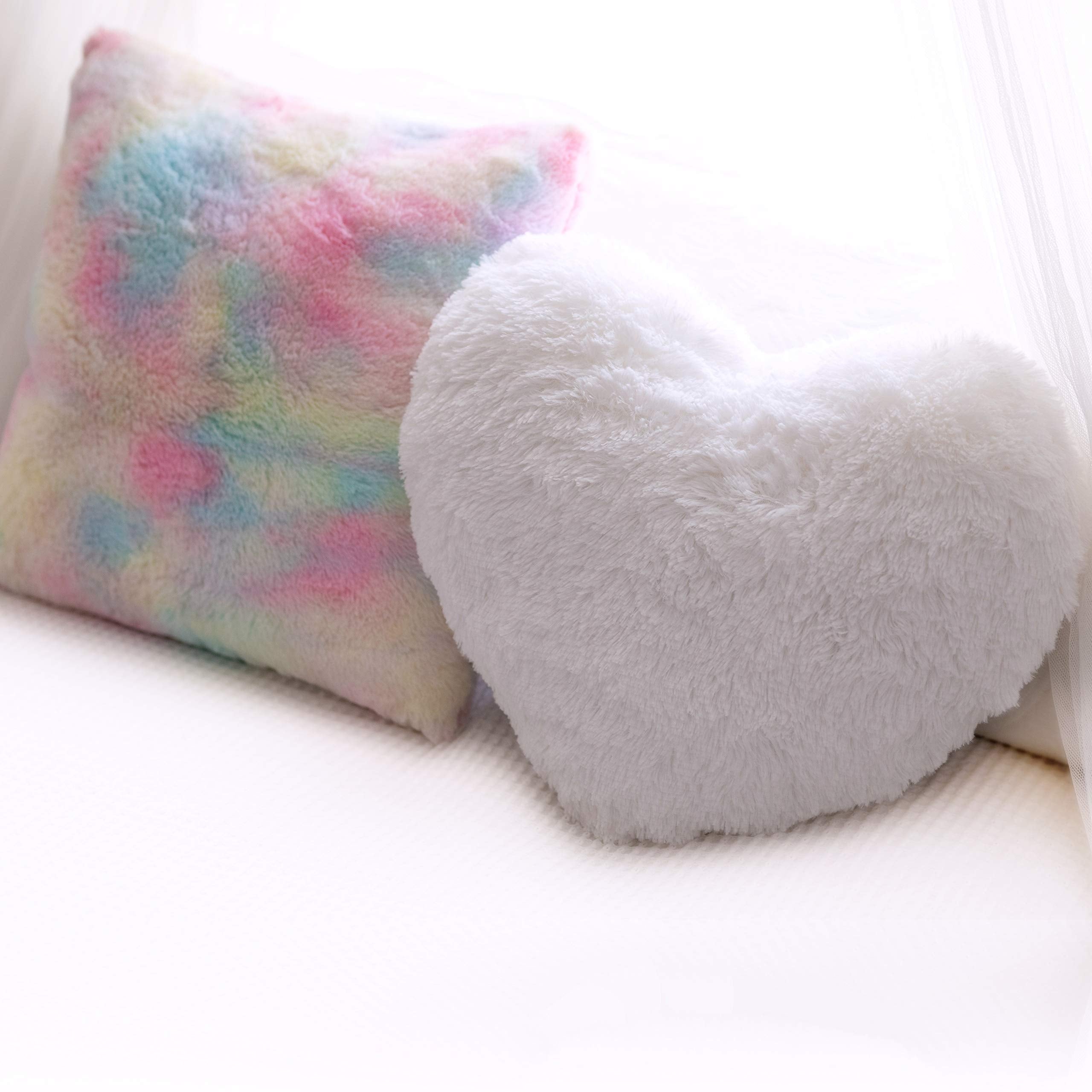 Perfectto Design rainbow plush pillow brightens a reading nook and bed.