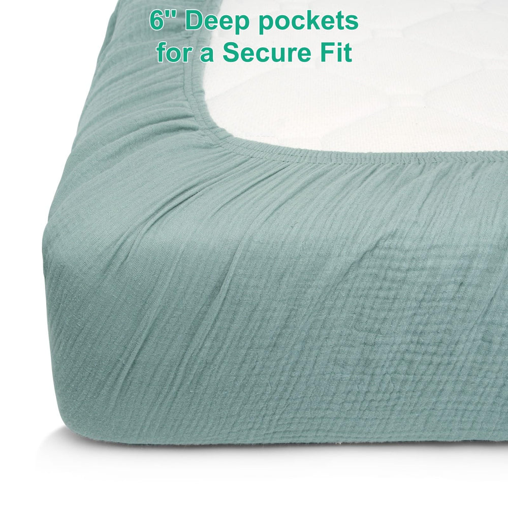 Pet Rejoir sage-green beige crib sheets styled in a boho nursery decor setting.