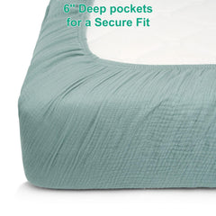 Pet Rejoir sage-green beige crib sheets styled in a boho nursery decor setting.