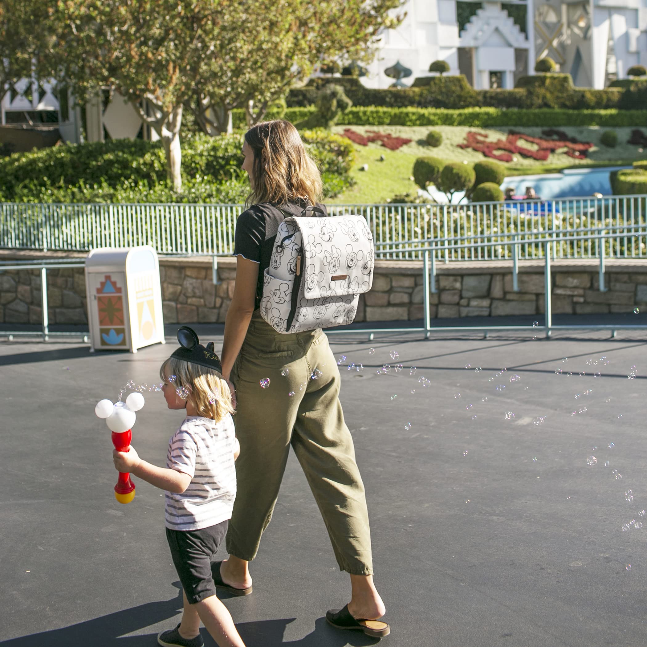 Petunia Pickle Bottom Boxy Backpack with water-resistant lining protects contents from spills.