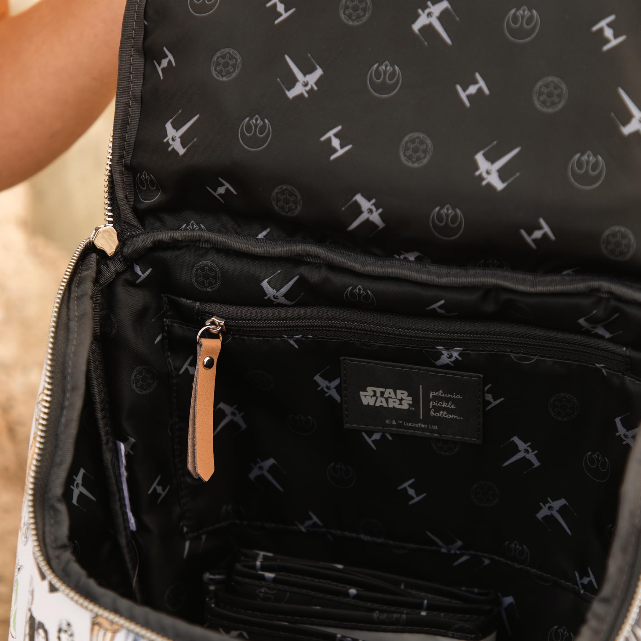 Petunia Pickle Bottom Method Backpack stroller clip pairs with carriers for hands-free outings.