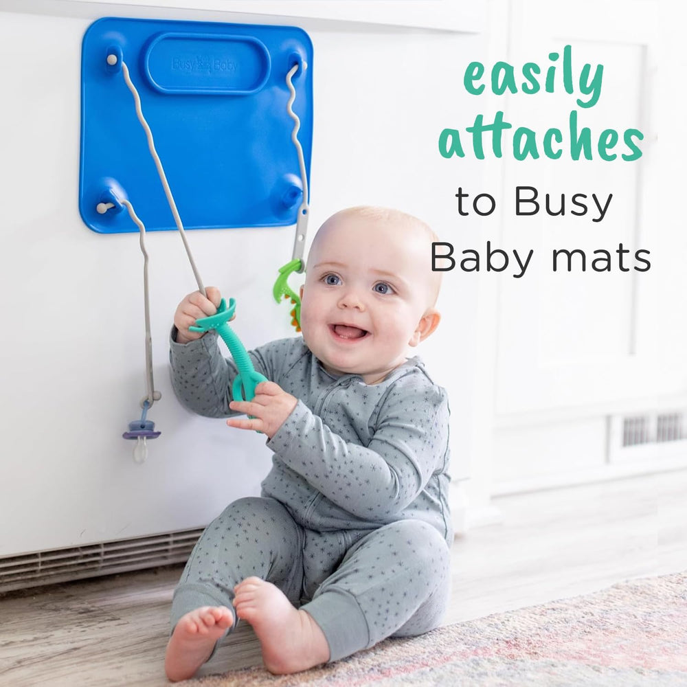 Pewter Busy Baby teething spoon showcases color and durable silicone for baby-safe meals.
