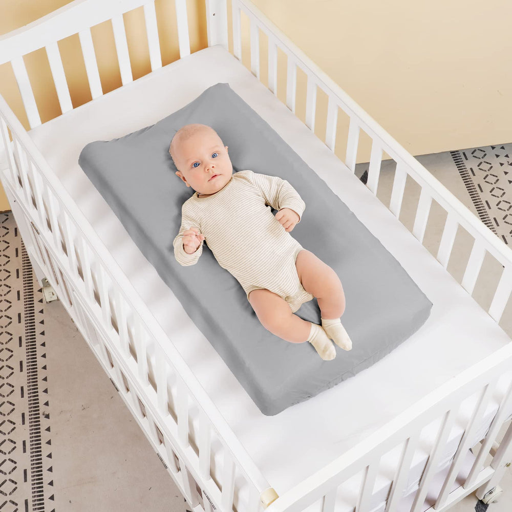 PHF changing pad cover grey two-pack demonstrates safety strap holes for secure changes