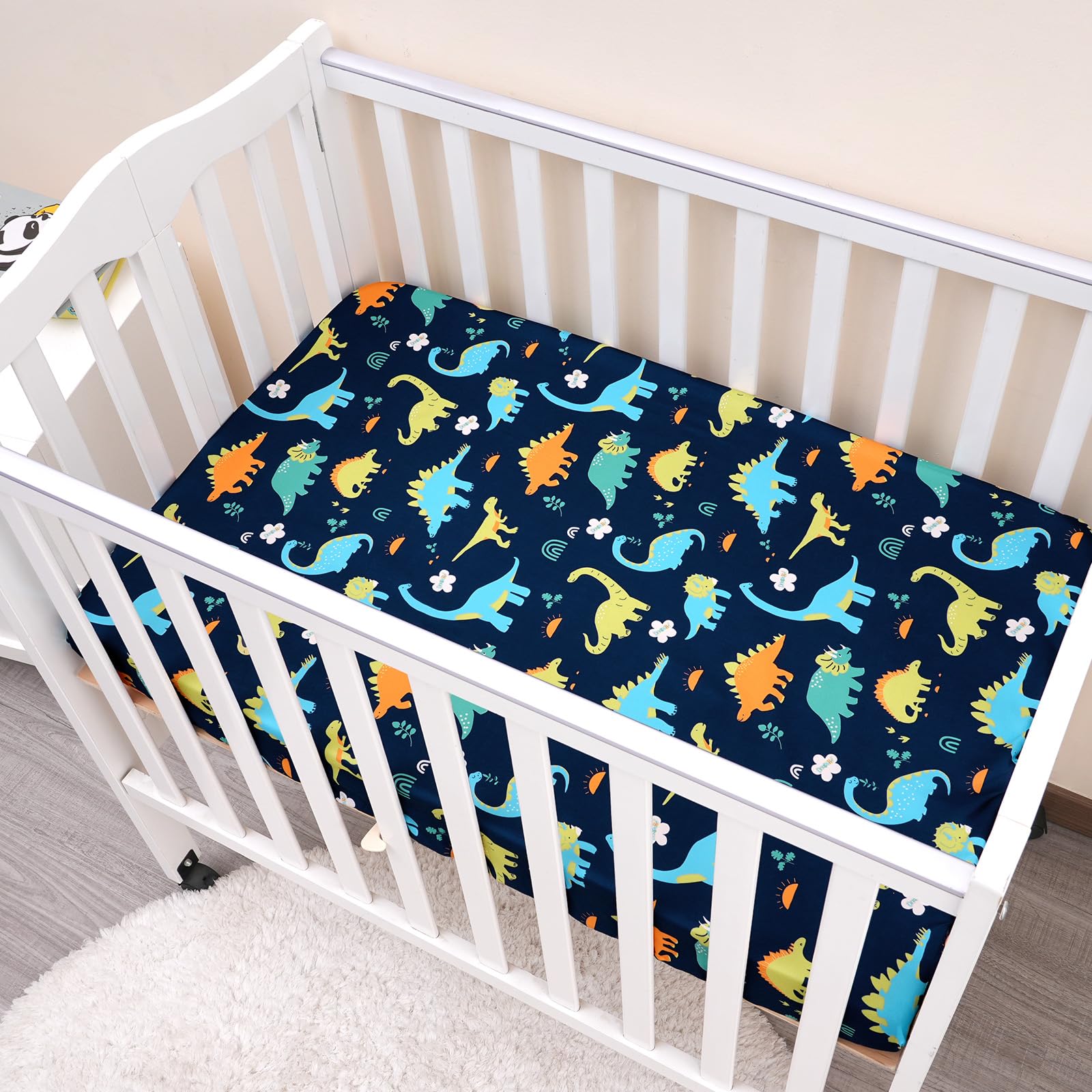 PHF dinosaur-pattern sheet used as a baby photo background adds playful charm