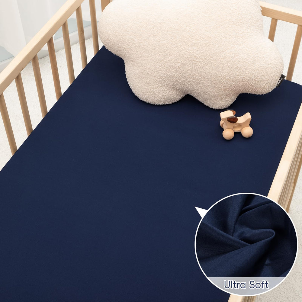 PHF navy dinosaur pattern adds playful style to nursery decor.