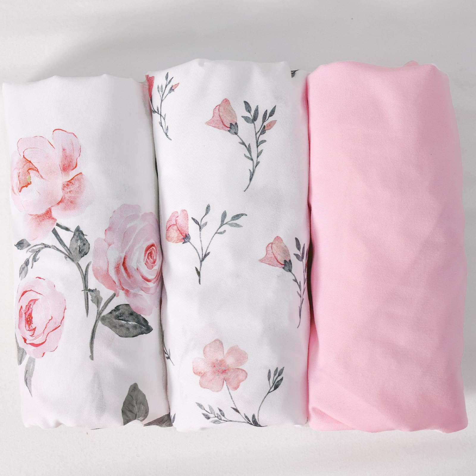 PHF rose floral sheets in use on a cradle showing secure fit.