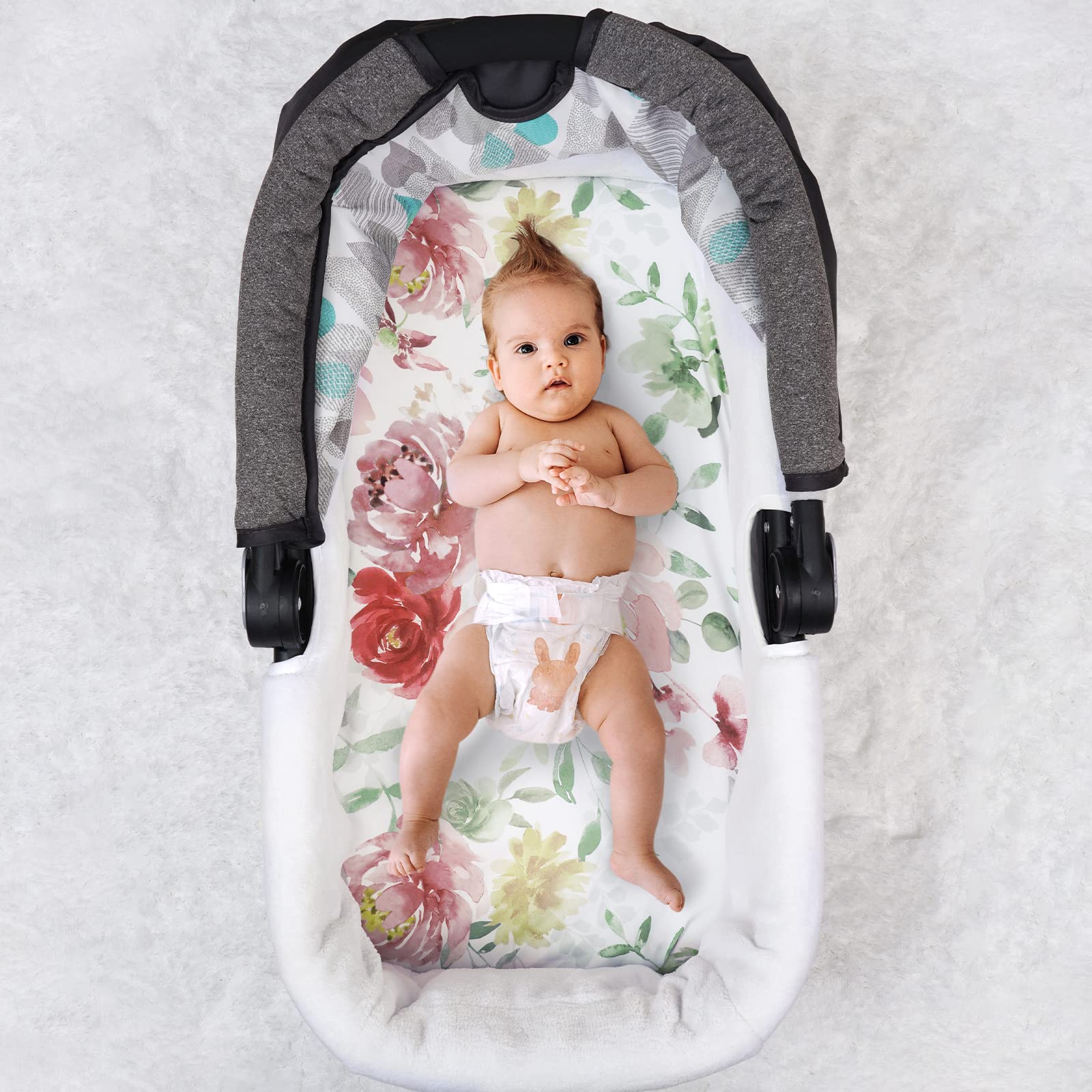 PHF Watercolor Floral bassinet sheets show vibrant design for baby photos.