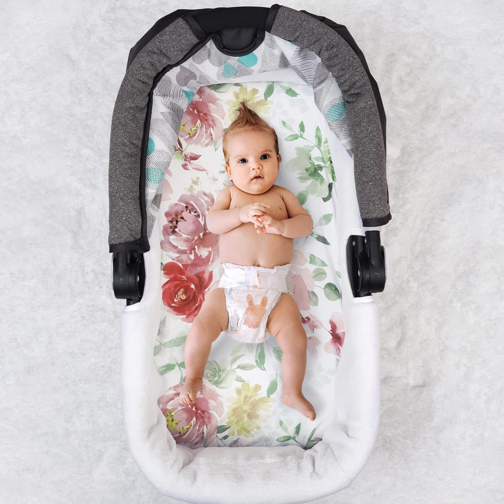 PHF Watercolor Floral bassinet sheets show vibrant design for baby photos.