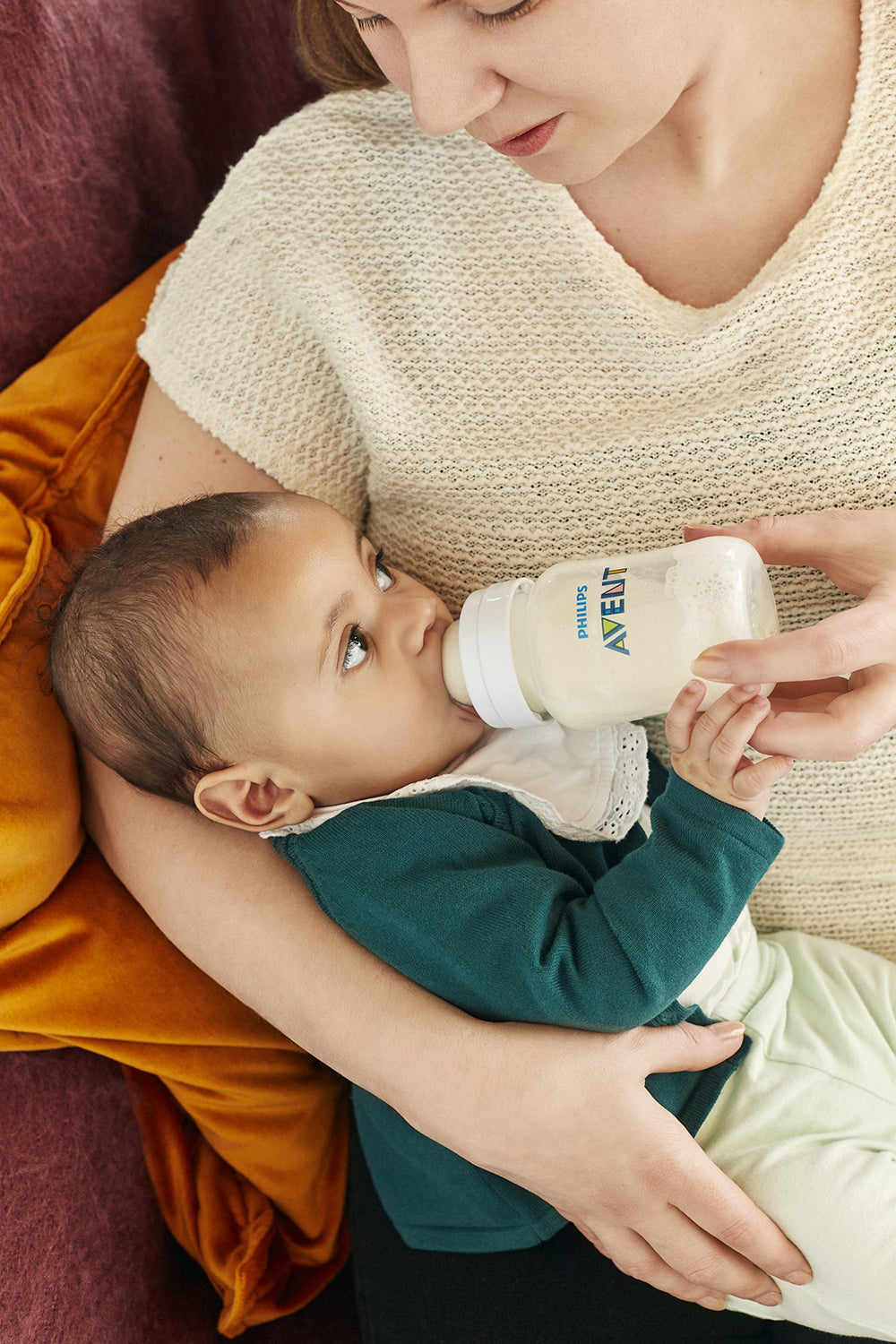 Philips Avent bottle parts separated, showcasing simple 4-piece assembly.