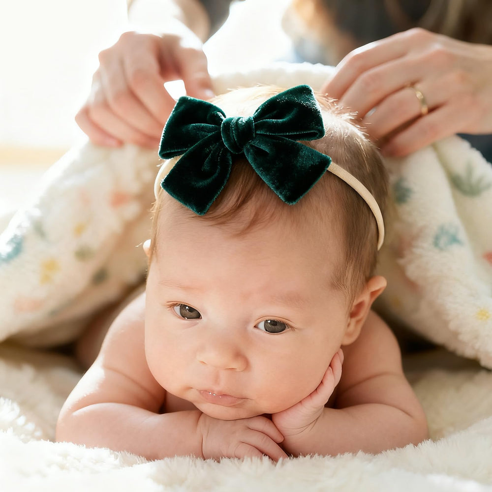 phnydreg velvet bow headband dark green side view showcases soft velvet against gentle elastic.