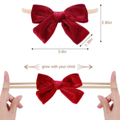 phnydreg velvet bow headband white side view demonstrates gentle stretch for lasting baby comfort.