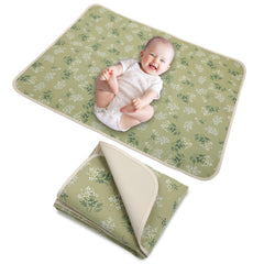 PHOEBUS BABY double-sided changing pad with soft muslin and waterproof leather for versatility.