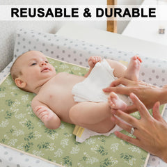 PHOEBUS BABY changing pad with muslin front panel for gentle skin contact during changes.