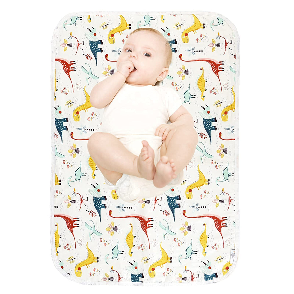 PHOEBUS BABY dinosaur changing pad top view shows soft cotton surface for gentle diaper changes.