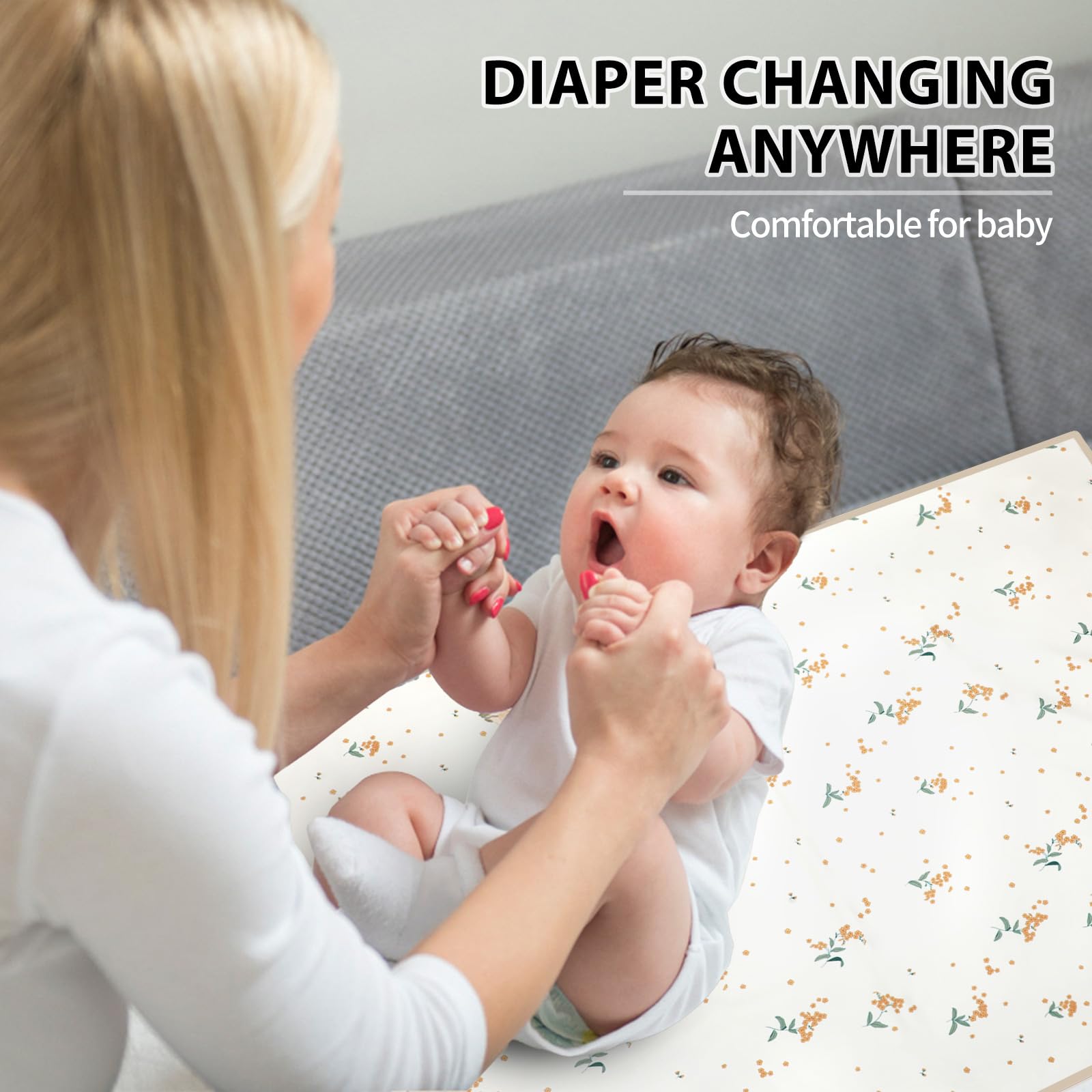 Phoebus Baby orange floral changing mat suitable for newborns and toddlers.