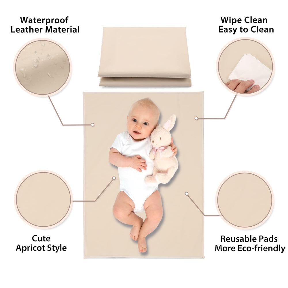 PHOEBUS BABY vegan leather changing mat in apricot rolled up for travel convenience.