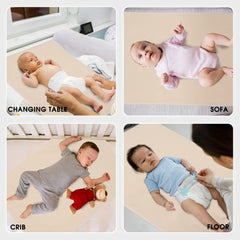 PHOEBUS BABY vegan leather changing mat used on a bed for comfy diapering sessions.