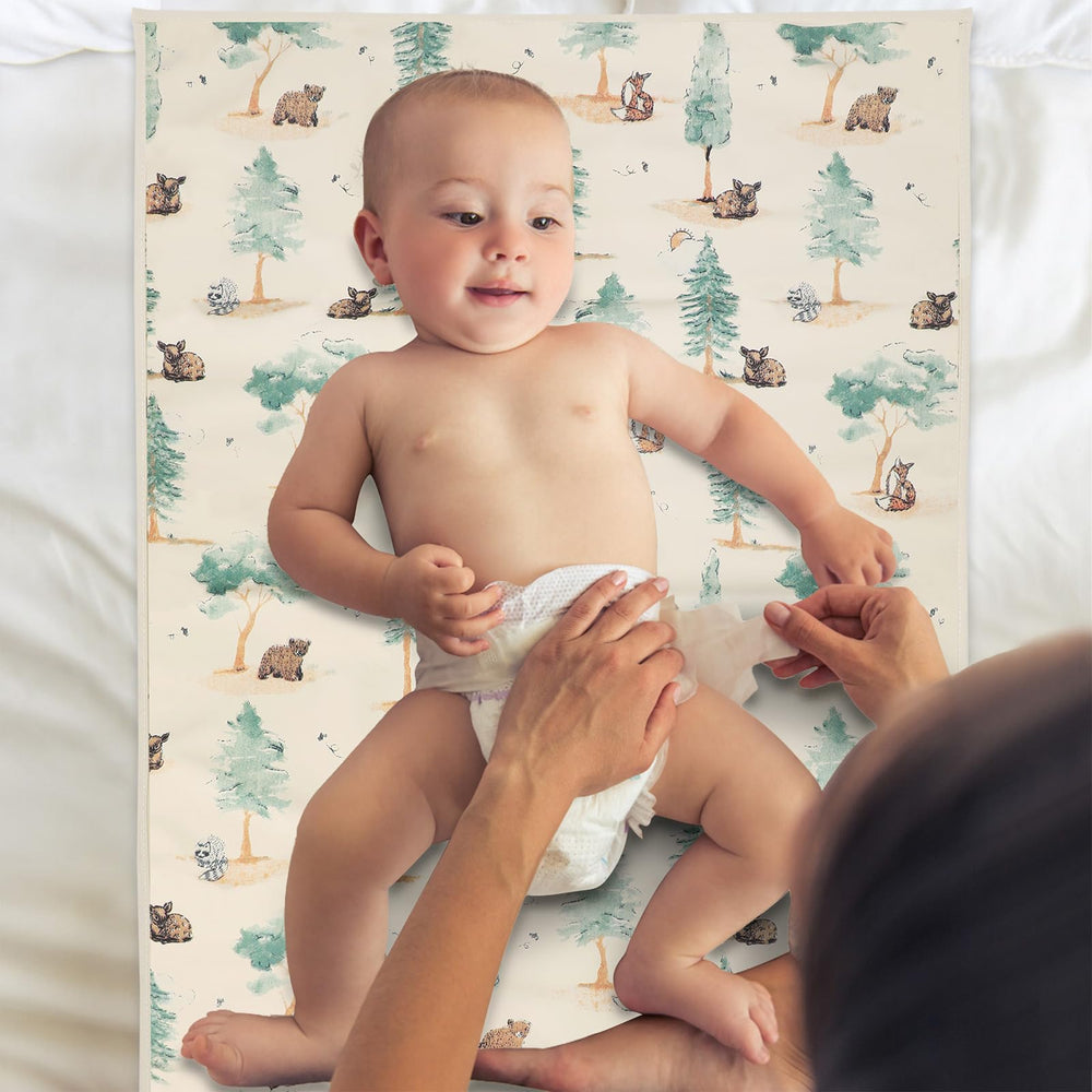 PHOEBUS BABY vegan leather changing mat forest flat lay bedside use.