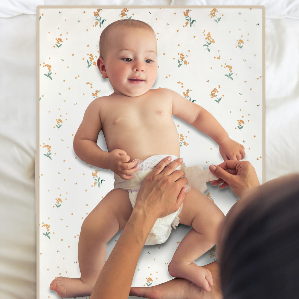 Phoebus Baby vegan leather changing mat wipe-clean surface stays clean.