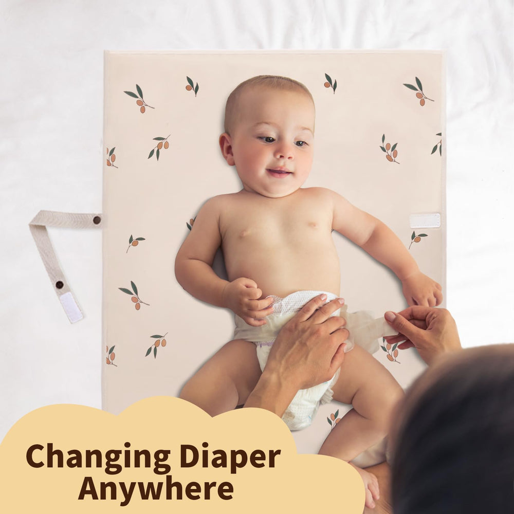 PHOEBUS BABY strap-equipped changing pad attached to stroller for hands-free changes.
