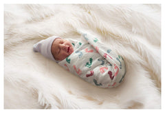 PILL THING baby footprint design blanket close-up showing soft cotton for swaddling.