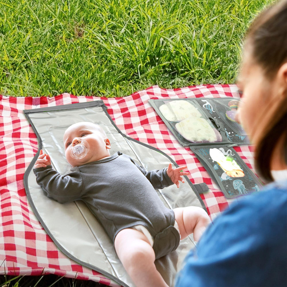 Pillani portable changing pad open layout, provides quick diaper access on outings.