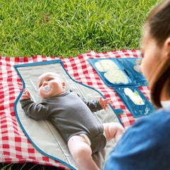 Pillani portable changing pad open reveals full 27x22 inch changing area for comfort.