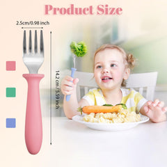Pimoys stainless steel toddler fork close-up shows rounded tines for safety.