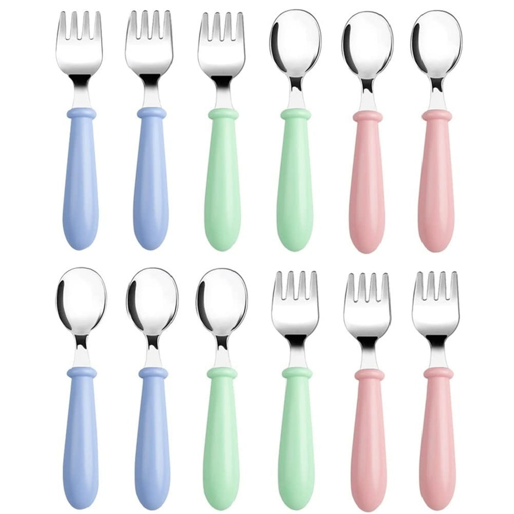 Pimoys toddler utensils pink fork close-up for safe self-feeding.