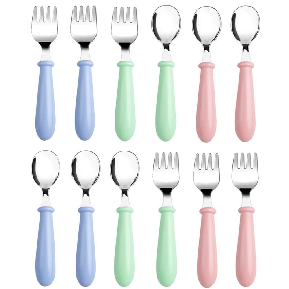 Pimoys toddler utensils pink fork close-up for safe self-feeding.
