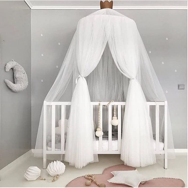 Pinkrin bed canopy over crib with star decor for a magical princess space.