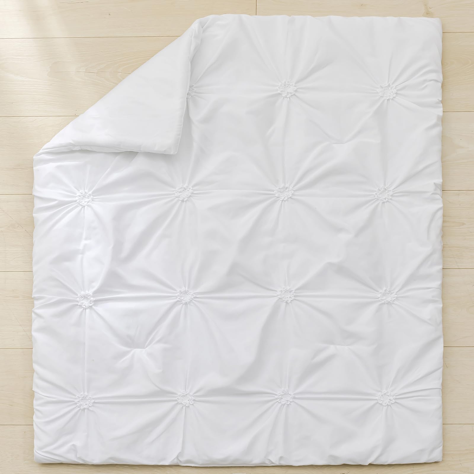 PINNKKU 14-inch drop crib skirt demonstrates full coverage and hidden storage space.