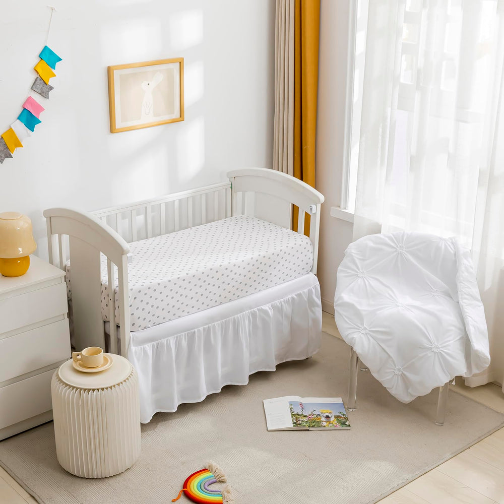 PINNKKU crib sheet 28x52 close-up shows precise sizing for standard cribs.