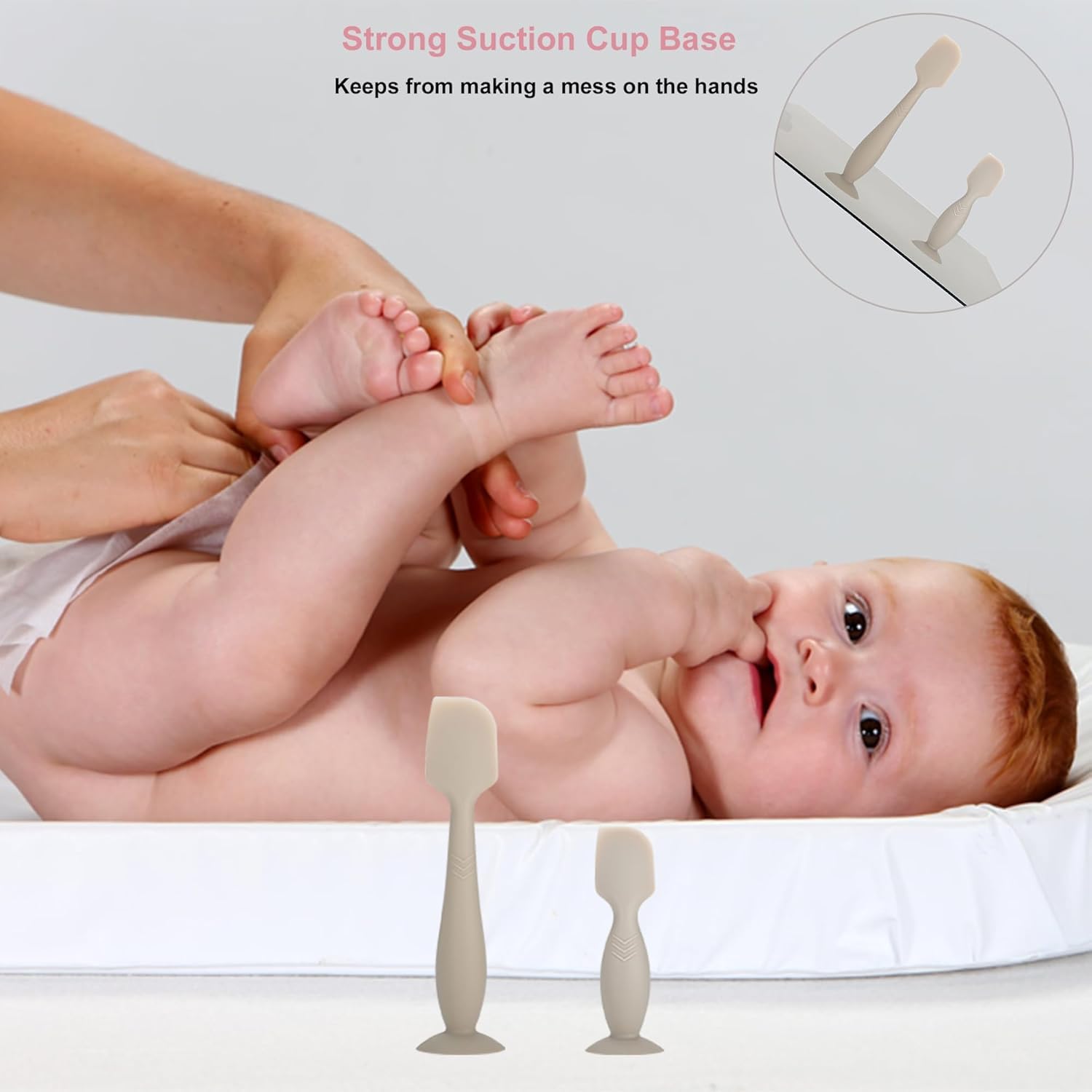 Pisool spatula with suction base fixed to a flat surface for hands-free use.
