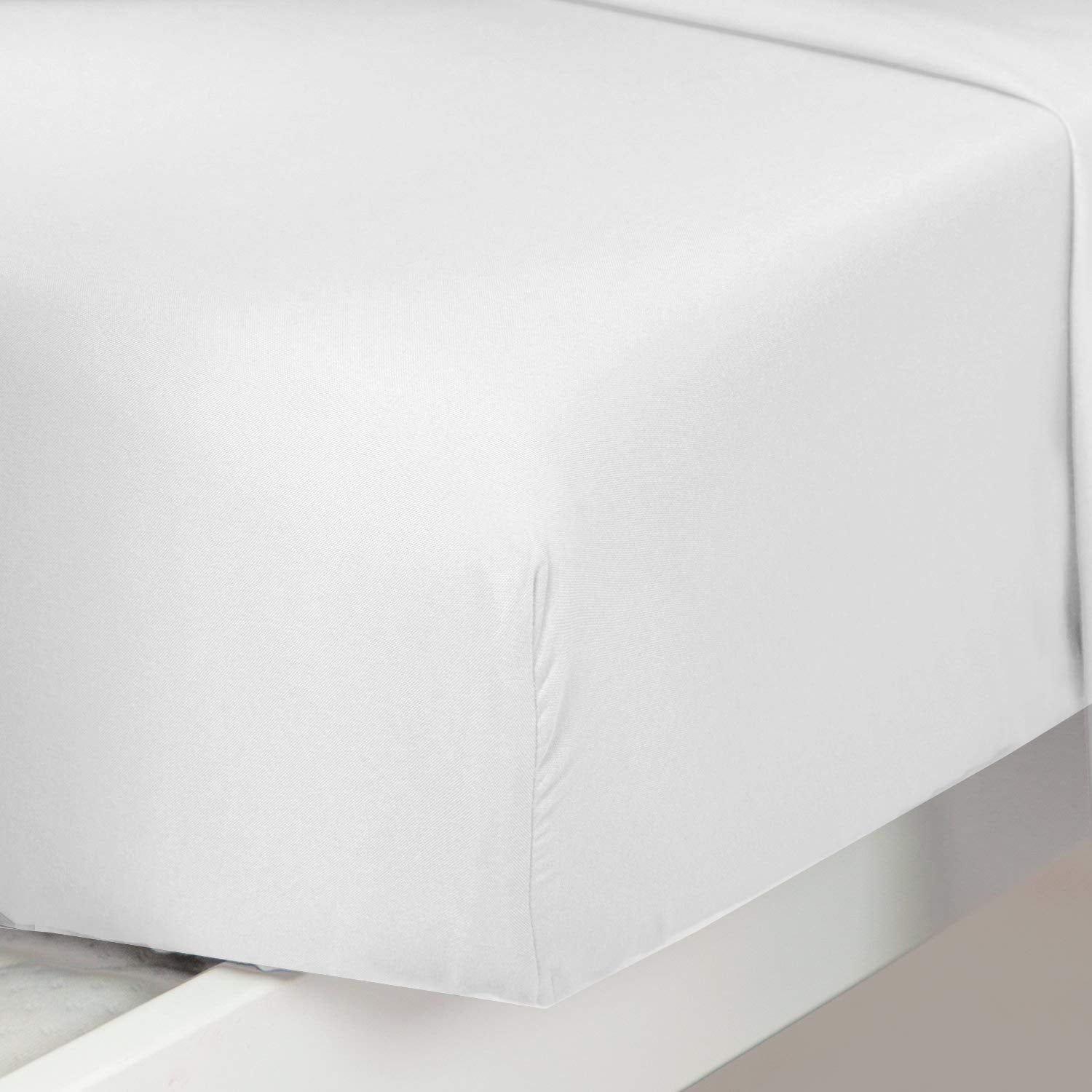 Plain Printed Linen fitted sheet demonstrates secure 8-inch pocket fit on standard toddler crib.