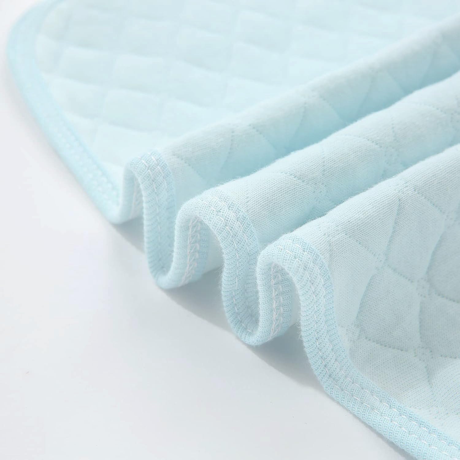 Pleasant Boulevard blue changing pad showing waterproof back for spills