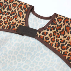 Plie bib on child with pull-over neckline demonstrates quick on-off accessibility during meals