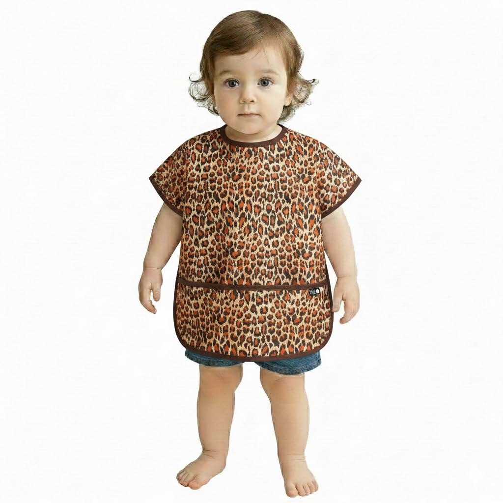 Plie short sleeve bib in brown leopard on child during mealtime for easy cleanup