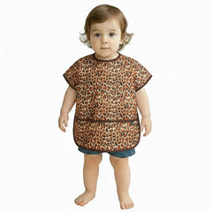 Plie short sleeve bib in brown leopard on child during mealtime for easy cleanup