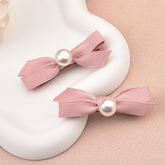 Pliwcas soft pink satin ribbon hair clip offers gentle shine on any style.